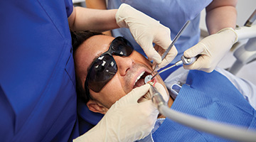 dentist working on man's smile