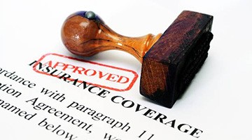 Approved stamp on insurance coverage form