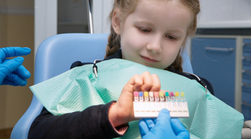 child chooses colored tooth filling