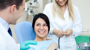 woman talking with dentist