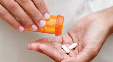 hand holding pills