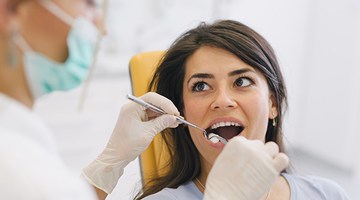 Woman receiving dental treatment