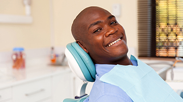 man relaxing in dental chair