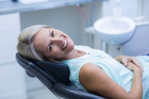 A happy woman in the dental chair.