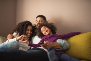 happy family sitting on a couch