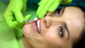 Patient being fitted with porcelain veneers